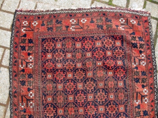 An antique belouch rug nice colours even corrosion and a few other issues as seen but a very pretty antique rug will clean well approx. 4ft9 x 2ft9.     