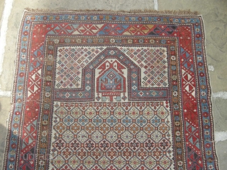 A good 19th century shirvan prayer rug in original condition needs a clean light wear and a few small holes but with ends and sides mostly in tact.     