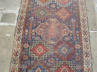 a very beautiful mid or early 19th century nw persian ?kurdish runner. Approx 15ft x 3ft. I think it's missing an outer guard there are condition issues. Low parts two very old  ...