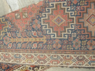 a very beautiful mid or early 19th century nw persian ?kurdish runner. Approx 15ft x 3ft. I think it's missing an outer guard there are condition issues. Low parts two very old  ...