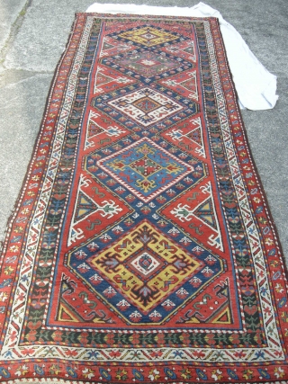 A great coloured south Caucasian long rug 19th century all good colour including cochineal. Approx 10ftx3ft6. Some corrosion bud good pile. Wonderful saturated colours.         