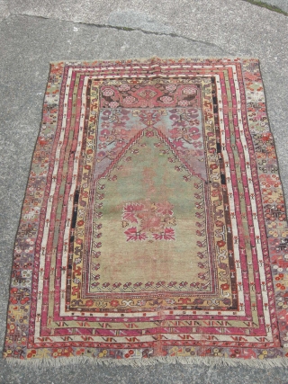 Antique Turkish prayer rug green ground, 145x 115 cm,
damage and old repairs, good colours .                  