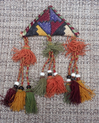 Here is a beautiful old Chodor Turkoman embroidered Talisman/Amulet which would have been worn to ward off evil/bring good luck. The talisman is embroidered in nine colors of silk thread: white, yellow,  ...