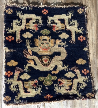   

 Here is a whimsical Tibetan Dragon sitting mat. Probably
 dating to the early 1900's or possibly earlier. The mat
 measures 24" X28" (61 cent. X 71 cent.) and is  ...