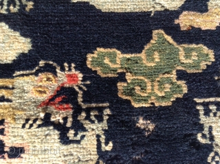   

 Here is a whimsical Tibetan Dragon sitting mat. Probably
 dating to the early 1900's or possibly earlier. The mat
 measures 24" X28" (61 cent. X 71 cent.) and is  ...