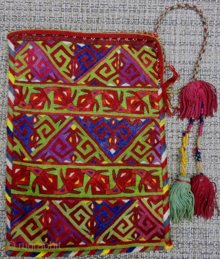    Here is a very large and stunning Ersari Turkoman embroidered purse.

  The truest color representtation is in my second photo (close up).

Measuring 6 1/2" X 9" the piece  ...