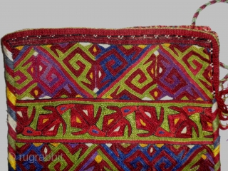    Here is a very large and stunning Ersari Turkoman embroidered purse.

  The truest color representtation is in my second photo (close up).

Measuring 6 1/2" X 9" the piece  ...