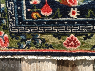  Here is a thick Tibetan sitting mat (around 125 years old) with brilliant,
all natural colors. The piece has shiny wool and good patina. The yellow coming through the greens tell of  ...