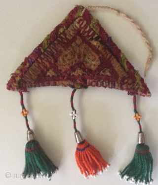  In the Central Asian Republics, people have made amulets in the shape of a triangle using felt, cloth or silver

             ...