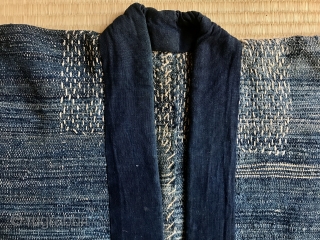 A stunning fisherman's coat from Aomori. A thickly woven jacket worn by a fisherman, probably a man with a higher rank. The condition is outstanding with stitching around neck and armpits. Superstitious  ...