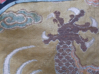 Rare fragment of a weaving for a semiformal imperial court robe, the 5 clawed dragon suggesting it was intended for the emperor or empress. Gold brocaded silk with a central Long among  ...