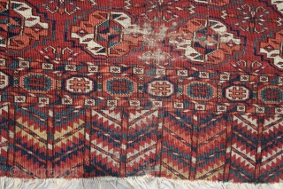 TEKKE small rug (wedding?). 41" x 53" from the 4th quarter of the 19th Century.  Missing a bit on both sides. Interesting primary side borders.One area (shown) that needs re-knotting. Glossy,  ...