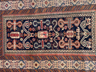 A very fine perepedil shirvan rug size 150x100 cm in very good condition with unusual kilims in the ends from both sides 
Dated 1319 Hijri
In the middle it shows a human riding  ...