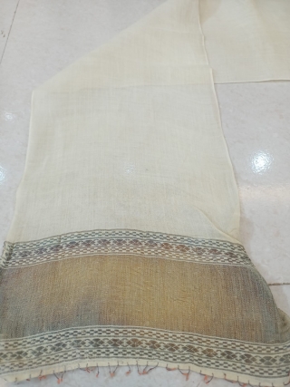 Antique white silk turban with golden border.                          