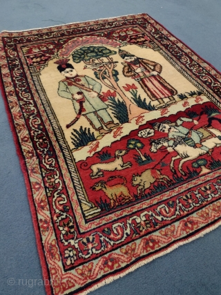 This is an antique Kerman Ravar Rug woven circa 19th century and it measures 76 x 57 in CM. It has a pictorial design with Persian calligraphy with beautiful colors.   