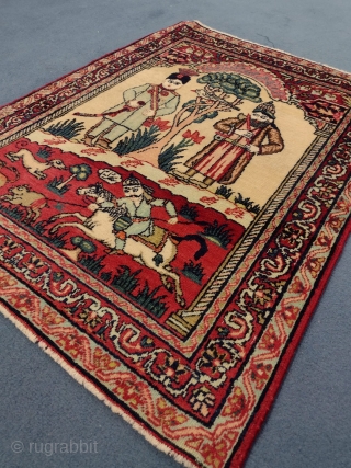 This is an antique Kerman Ravar Rug woven circa 19th century and it measures 76 x 57 in CM. It has a pictorial design with Persian calligraphy with beautiful colors.   