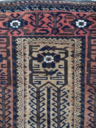 Beautiful Antique Persian Baluch Mashad Rug, 1880-1900
120 × 70 cm (3' 11" × 2' 3")

The light beige field with overall design of angular Hooke vine and lozenge palmettes. In broad light red  ...