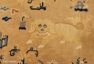 This is an antique Ningxia carpet from China and it was woven during the 18th century. It has a central foo dog and many more throughout the rest of the rug. It  ...