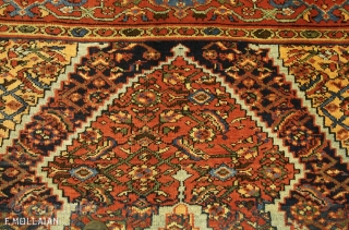 An antique Mahal carpet, West Persia, ca. 1900

The shaded indigo fiend with stylised polychrome herati design. Two rust-red and sandy-yellow large serrated medallions with similar design. Sandy-yellow herati spandrels. In rust red  ...