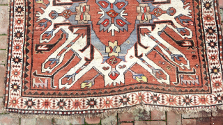 Caucasian Eagle Kazak- approx. 5 x 7.8.  Two open field ivory/blue medallions with iconic Cheleberd/Sunburst motifs. Circa late 19th/early 20th cent. Pile is low but even with some iron oxidation. Imperfections  ...