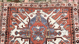 Caucasian Eagle Kazak- approx. 5 x 7.8.  Two open field ivory/blue medallions with iconic Cheleberd/Sunburst motifs. Circa late 19th/early 20th cent. Pile is low but even with some iron oxidation. Imperfections  ...