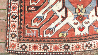 Caucasian Eagle Kazak- approx. 5 x 7.8.  Two open field ivory/blue medallions with iconic Cheleberd/Sunburst motifs. Circa late 19th/early 20th cent. Pile is low but even with some iron oxidation. Imperfections  ...