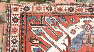 Caucasian Eagle Kazak- approx. 5 x 7.8.  Two open field ivory/blue medallions with iconic Cheleberd/Sunburst motifs. Circa late 19th/early 20th cent. Pile is low but even with some iron oxidation. Imperfections  ...