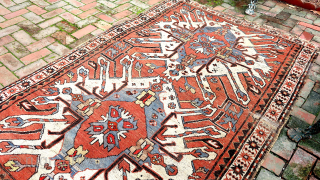 Caucasian Eagle Kazak- approx. 5 x 7.8.  Two open field ivory/blue medallions with iconic Cheleberd/Sunburst motifs. Circa late 19th/early 20th cent. Pile is low but even with some iron oxidation. Imperfections  ...