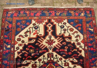 Bahktiari. 4 ft 5 inches by 6 ft 5 inches. Bold medallion rug with lots of ivory and great vivid color. Humans, birds, fish. Unusual green overcast on the sides appears to  ...