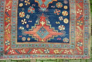Kazak.  5 ft 2 inch x 8 ft-- Nice larger size. I think circa 1900 Period. Dynamic three medallion design and great colors. A bit of foundation spots-- mainly via brown  ...