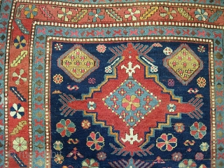 Kazak.  5 ft 2 inch x 8 ft-- Nice larger size. I think circa 1900 Period. Dynamic three medallion design and great colors. A bit of foundation spots-- mainly via brown  ...