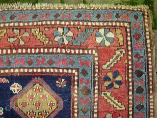 Kazak.  5 ft 2 inch x 8 ft-- Nice larger size. I think circa 1900 Period. Dynamic three medallion design and great colors. A bit of foundation spots-- mainly via brown  ...