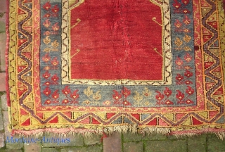 Old Anatolian-- approx 3 x 5. Possibly an antique Mudjar(?) And God knows how old. It looks ancient. Thick and floppy with really nice colors. What's going on in the middle? frayed  ...