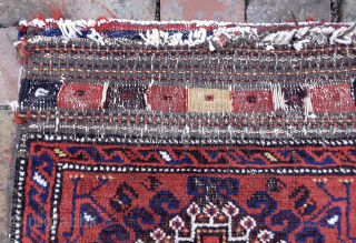 Antique Baluchi Bag c. 19th cent-- approx 18 x 20”

Red field with single medallion and animal figures in corners. Gray striped back. Rare “left hand knotting—(in which the open side is right).  ...