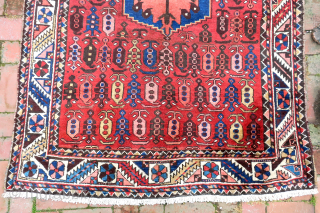 Bahktiary-- 4.7 x 6.5-- Small repetitive botehs and hearth medallion on red field. Unique tribal design in very good condition. ($20 USA shipping)          