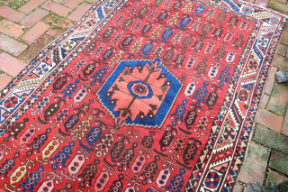Bahktiary-- 4.7 x 6.5-- Small repetitive botehs and hearth medallion on red field. Unique tribal design in very good condition. ($20 USA shipping)          