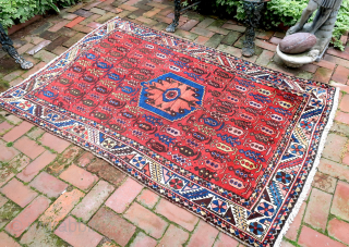 Bahktiary-- 4.7 x 6.5-- Small repetitive botehs and hearth medallion on red field. Unique tribal design in very good condition. ($20 USA shipping)          