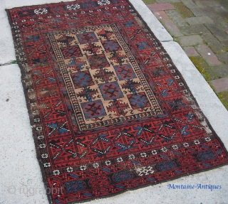 Belouchi-- 3 ft 0 by 5 ft 0 inches. An old and timeworn rug. Pretty unusual and interesting design.              