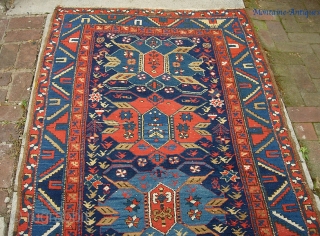 Old Azerbeijan runner  3 ft 6 by 14 ft. Wool foundation and might have been woven either side of the border.  Looks 19th century to me. Pretty nice condition. Shows  ...