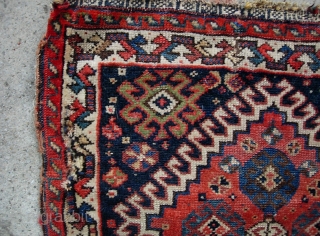 Qashqai 21 inches by 23 inches. Ancient little rug. Rough but still beautiful $12 to ship in usa.               