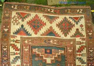 Ancient Caucasian. 3 ft 3 in x 10 ft 11 in. Moghan? Kazak?  Great archaic motifs. Interesting design change on the end borders. Wool is plush and grainy in texture. I  ...