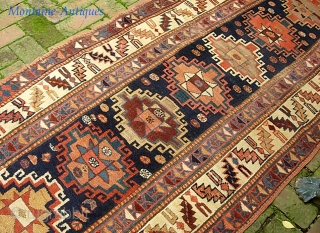 Ancient Caucasian. 3 ft 3 in x 10 ft 11 in. Moghan? Kazak?  Great archaic motifs. Interesting design change on the end borders. Wool is plush and grainy in texture. I  ...