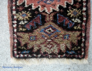 Kurdish. 13 inches by 27 inches. Real unique piece and may have been a bag or pillow cover. Aubergine weft with considerable fading where exposed. Great condition w/ extremely thick lustrous pile.  ...