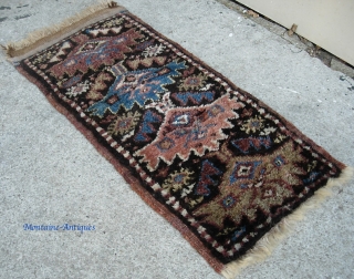 Kurdish. 13 inches by 27 inches. Real unique piece and may have been a bag or pillow cover. Aubergine weft with considerable fading where exposed. Great condition w/ extremely thick lustrous pile.  ...