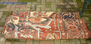 Serapi-- 8 ft 10 in x 12 ft 3 in. A legit antique rug, probably 19th century. It is very open and the medallion is proportionally huge.  Very interesting design and  ...