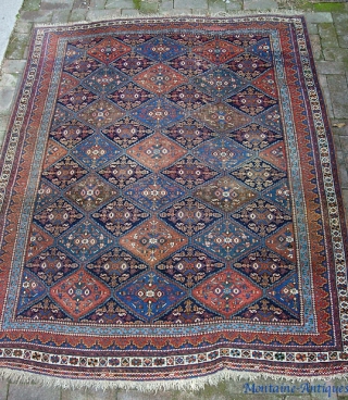 squarish Afshar  5 ft  6 in. by 7 ft.  Wool foundation; 100 years old. All vegetable. Some brown oxidation (mostly in one gul); otherwise, nice condition.    