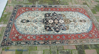 Fereghan Sarouk. 4 ft 4 inches by 6 ft 5 inches.  19th century rug ex. Ben Edwards collection. Hugely decorative old thing w/ big bright ivory medallion. Strong colors w/ numerous  ...