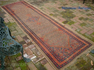 Camel Hamadan. 3 ft 2 inches by 10 ft 1 inches. Real old one-- possibly 19th century. Wool foundation. There are two old square reweaves. Even low pile and a couple small  ...