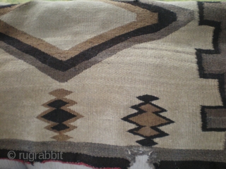 As found: A 1920's to 1930's Navajo rug, measuring 44"x91" (3'8"x7'7"), needs some reweaving on one end in three places, otherwise, pretty sound rug.  I like it's simplicity and large size  ...