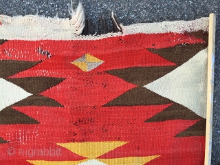 As found: Turn of the century transitional Navajo rug measuring 4'4"x 6'6" in need of service.  Ends need to be partially rewoven as well as some scattered area's in the field.  ...